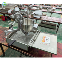 Machine à beignets commerciale à distribution automatique de pâte, avec convoyeur à vitesse uniforme, faible taux de bris et friteuse professionnelle pour desserts