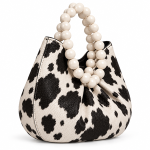 Sac en cuir à imprimé vache avec fermeture à boucle, motif noir et blanc, sac à main à bandoulière - Product Image 1