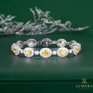 Refined Fancy Yellow Lab Grown Diamond Tennis Bracelet Featuring Oval Stones With White Diamond Halo <b>Frames</b> And Prong Settings - Product Image 5