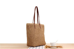 Upgrade your accessory collection with this premium Natural yarn bag designed with a classic open <b>top</b> and slender leather handle - Product Image 2