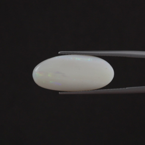 โอปอลสีขาวคุณภาพสูง น้ำหนัก 7.42 กะรัต ธรรมชาติ รับรองโดย IGI รูปทรงวงรี ขัดเงาด้วยมือ ผ่านการเคลือบด้วยแว็กซ์/น้ำมัน ขนาด 23x11 มม. - Product Image 1