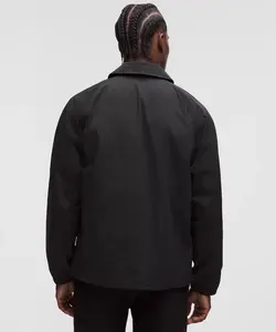 Veste Coach Homme Noire avec Fermeture Éclair, Patchwork Camouflage, Tissu Polyester Imperméable et Respirant, Design Classique Boutonné - Product Image 4