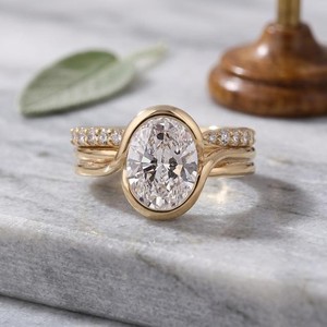 Oval Cut Diamond Bezel Set Engagement Ring in Yellow Gold with Pavé Diamond Band Modern Solitaire Bridal Ring Elegant Fine Jewel - Product Image 1