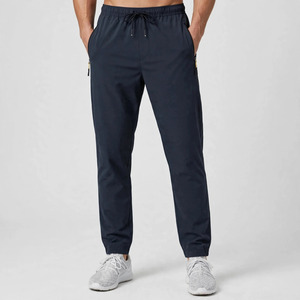 Pantalon décontracté pour homme en polyester léger bleu marine avec cordon de serrage, poches latérales, taille élastique respirante, coupe tricotée pour l'été - Product Image 1