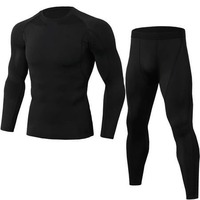 Ensemble de sport pour homme, noir uni, compression, haut à manches longues et col rond, pantalon à taille élastique, logo sur le devant, coupe sportive