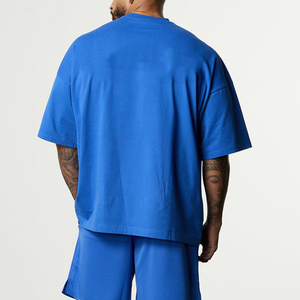เสื้อยืดคอกลมแขนยาวทรงหลวมสำหรับผู้ชาย สีน้ำเงินล้วน ผ้าฝ้ายถัก 100% สวมใส่สบาย - Product Image 4
