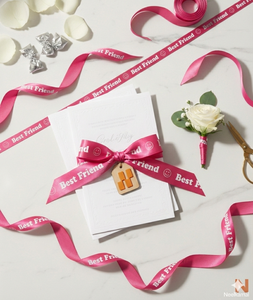 ริบบิ้นผ้าซาตินสีชมพูพิมพ์ลายเพื่อนซี้ ขนาด 10 มม. ผลิตจากโพลีเอสเตอร์ 100% ยี่ห้อเนลกามัล อินดัสทรีส์ ทนต่อการหดตัว เหมาะสำหรับตกแต่งและห่อของขวัญ - Product Image 1