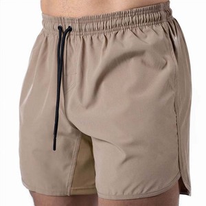 Shorts pour hommes à couleur unie, séchage rapide, avec cordon de serrage, taille mi-haute, décontractés, pour la gym et l'entraînement, en tissu polyester, avec poches - Product Image 1