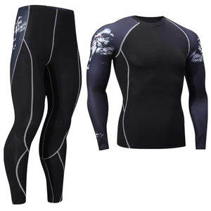Conjunto de compresión de manga larga para hombre, color negro, cuello redondo, de secado rápido, licra y poliéster, top de manga larga y pantalones, kit sólido para todas las estaciones - Product Image 1