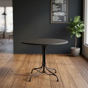 Mesa de Centro Redonda Rústica de Hierro con Superficie de Metal Negro Texturizado y Base de Pedestal Curvo - Product Image 1