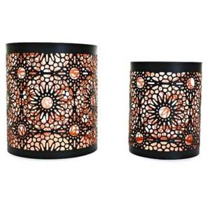 Portavelas de metal artesanales diseñados para realzar interiores con una iluminación y forma serenas. - Product Image 6