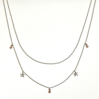 Collier double rangs empilable polyvalent Gemnel avec mini-breloques étoile de mer en zircon cubique pour un style superposé