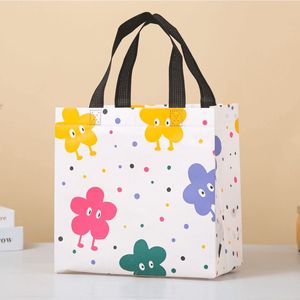 Bolsa de compras de tela no tejida con estampado de flores de dibujos animados, con asa de cinta de polipropileno, tamaño mediano, para tiendas de ropa. - Product Image 1