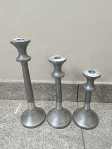 Modern Tapered <b>Silver</b> Metal <b>Candlestick</b> Holders (Set of 3) Designed with sleek, slender stems that flare into sturdy bell bases - Product Image 1