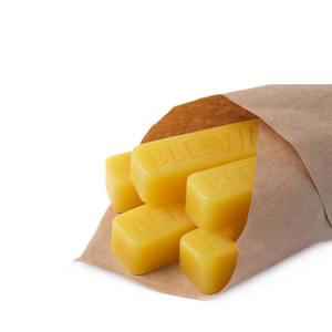 Experience premium pure yellow and white beeswax for facial use with a natural raw honey aroma supplied in bulk quantities - Product Image 1