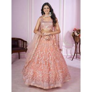 This peach pink lehenga choli blends soft elegance with heavy embroidery Perfect for creating a dreamy festive look - Product Image 1