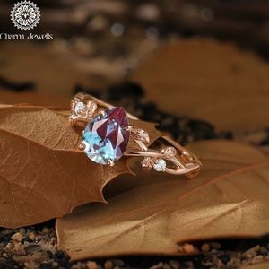 Bague de fiançailles classique et romantique en argent plaqué or rose avec moissanite taille coussin, sertie à griffes, certifiée IGI, par Charm Jewells - Product Image 2