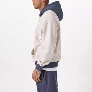 Vente en gros de sweat à capuche de fitness pour hommes en coton doux avec de grandes poches épissage couleurs contrastées motif polaire imprimé taille libre hiver - Product Image 3