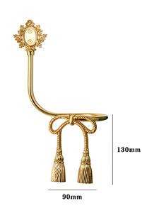 Sujetador de cortina decorativo de metal dorado con borla anudada y gancho para colgar en la pared, elegante soporte para cortinas para un estilo elegante en las ventanas del hogar. - Product Image 5