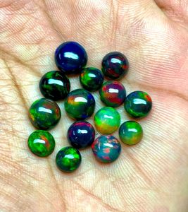 FF JEWELLERS Opale d'Éthiopie noire naturelle, taille brillant, cabochon, pierres précieuses en vrac, 8-10mm, effet de couleur, certifiées par un tiers - Product Image 1