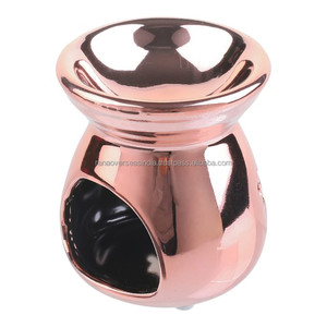 เตาอโรมาเซรามิกทองแดง พร้อมที่อุ่นเทียนหอม ดีไซน์ลายดาวและพระจันทร์ - Product Image 1