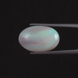 โอปอลแสงขาวธรรมชาติ น้ำหนัก 6.82 กะรัต รูปทรงวงรี 18x12 มม. รับรองโดย IGI  แบบเคลือบแว็กซ์/น้ำมัน ขายส่งสำหรับทำเครื่องประดับชั้นดีจากอินเดีย - Product Image 1