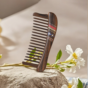 Fine-tooth <b>wooden</b> <b>comb</b> resting securely in its matching light-wood protective stand, available at wholesale prices. - Product Image 6