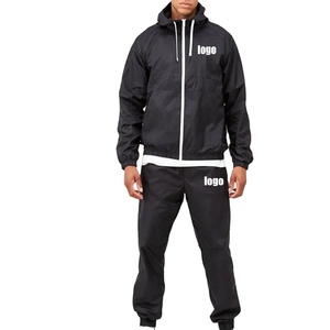 Vêtements streetwear de haute qualité pour hommes veste zippée à capuche en polyester avec logo personnalisé ensemble coupe-vent et pantalon de jogging survêtement - Product Image 1