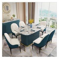 Table à manger rectangulaire moderne de luxe en marbre avec pieds en métal, chaises rembourrées bleu sarcelle, 6 places, finition dorée, bord brut imperméable, pour studio