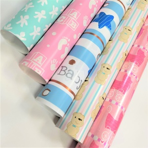 Rouleaux de papier cadeau sur le thème des bébés avec des ours en peluche, des blocs ABC, des empreintes de pieds, papier spécial écologique pour les cadeaux de fête pour enfants - Product Image 1