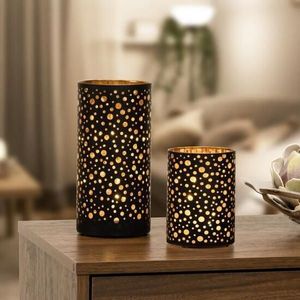 Portavelas votivo de metal hecho a mano que combina la artesanía experta con la luz relajante de las velas para una decoración consciente. - Product Image 1