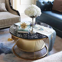 Table basse ronde de luxe en contreplaqué avec plateau en marbre noir et base en métal doré, table de salon moderne et contemporaine