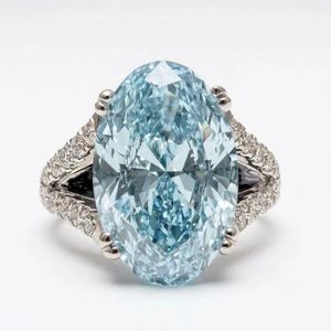 แหวนหมั้นเพชรทรงรีและทรงกลมสีน้ำเงินเพาะเลี้ยงในห้องปฏิบัติการ ทองคำขาว 10K ดีไซน์เรียบง่าย ฝังแบบหนามเตย รับรองโดย IGI สำหรับงานแต่งงาน - Product Image 1