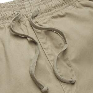 กางเกงชิโน่ผู้ชายแบบมีเชือกผูก เอวยางยืด สไตล์จ็อกเกอร์ ผ้าฝ้าย ใส่สบาย ดูดี - Product Image 3