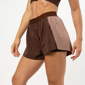 Shorts de yoga taille haute asymétriques en maille, résistants aux plis, bleu uni, sans coutures, extensibles dans quatre directions, pour fitness et entraînement en salle de sport - Product Image 1