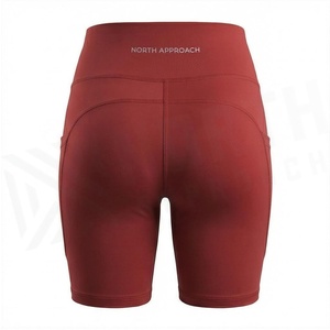 Shorts de yoga taille haute couleur unie avec poches, extensibles dans quatre directions, design sans couture pour femme, vêtements de sport - Product Image 3