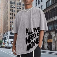 T-shirt en coton à manches courtes surdimensionné pour homme, col rond, imprimé, style jersey, avec la phrase « All We Need Is Money »