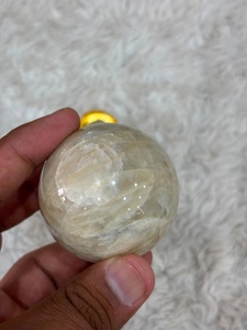 Cream moonstone <b>sphere</b> with soft ivory coloring subtle sheen rounded contours smooth polishing and refined mineral appeal - Product Image 5