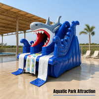 Structure gonflable multifonctionnelle en PVC pour usage domestique et extérieur, avec toboggan, piscine à balles et motif requin, installation facile, idéale pour garderies et zones résidentielles