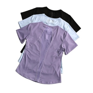 Camiseta de yoga de manga corta para mujer, de color sólido, de secado rápido, con logotipo personalizado bordado, precio de fábrica de Bangladesh y China. - Product Image 1