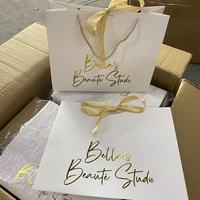Sacs en papier personnalisés écologiques en gros pour cadeaux et shopping avec marque privée