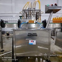 Machine de remplissage automatique de liquides à haute précision, à base de dosage volumétrique, pour bouteilles et contenants – Offre Spéciale