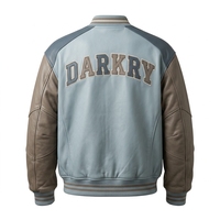 Veste universitaire en cuir véritable bleu clair et marron pour homme, coupe bomber, avec boutons-pression personnalisés et broderies de patchs