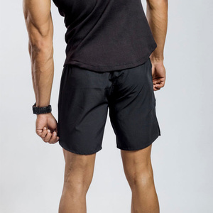 Men's <b>Black</b> Solid Quick Dry Breathable Sport Shorts Elastic Waist Knee Length Nonwoven Polyester Front Logo Drawstring Closure - Product Image 4