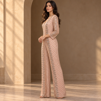 Combinaison de soirée sophistiquée rose poudré ornée de détails, col en V profond |   Combinaison de soirée longue à manches longues, à jambes larges et motifs argentés