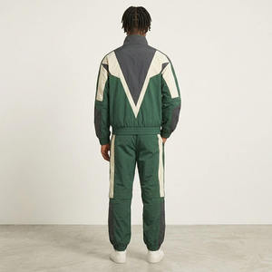 Ensemble de survêtement pour homme avec blocs de couleur, veste à col roulé zippée et pantalon, sportif, respirant, en polyester, pour l'automne, coupe-vent - Product Image 2