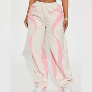 Pantalon parachute blanc ample pour femme avec logo personnalisé, coupe basse, cordon de serrage, coupe-vent en nylon, idéal pour l'hiver - Product Image 6