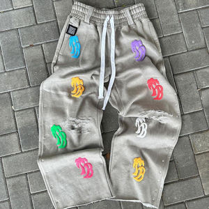 Pantalon de survêtement gris déchiré pour homme TITAN TREAD WEAR, 100% coton, logo en relief coloré, taille élastique avec cordon de serrage, pantalon hip hop - Product Image 1
