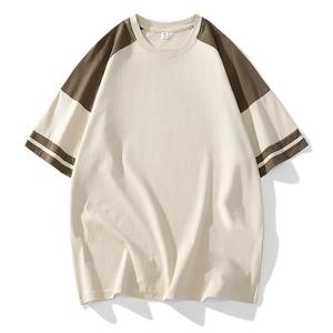 T-shirt blanc surdimensionné pour homme avec manches raglan noires et bordure contrastante, col rond décontracté, en jersey de coton - Product Image 1