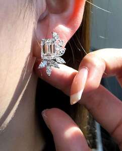 Radiant <b>emerald</b> solitaire <b>stud</b> <b>earrings</b> with marquise diamond accents in floral leaf setting refined luxury jewelry for women - Product Image 6